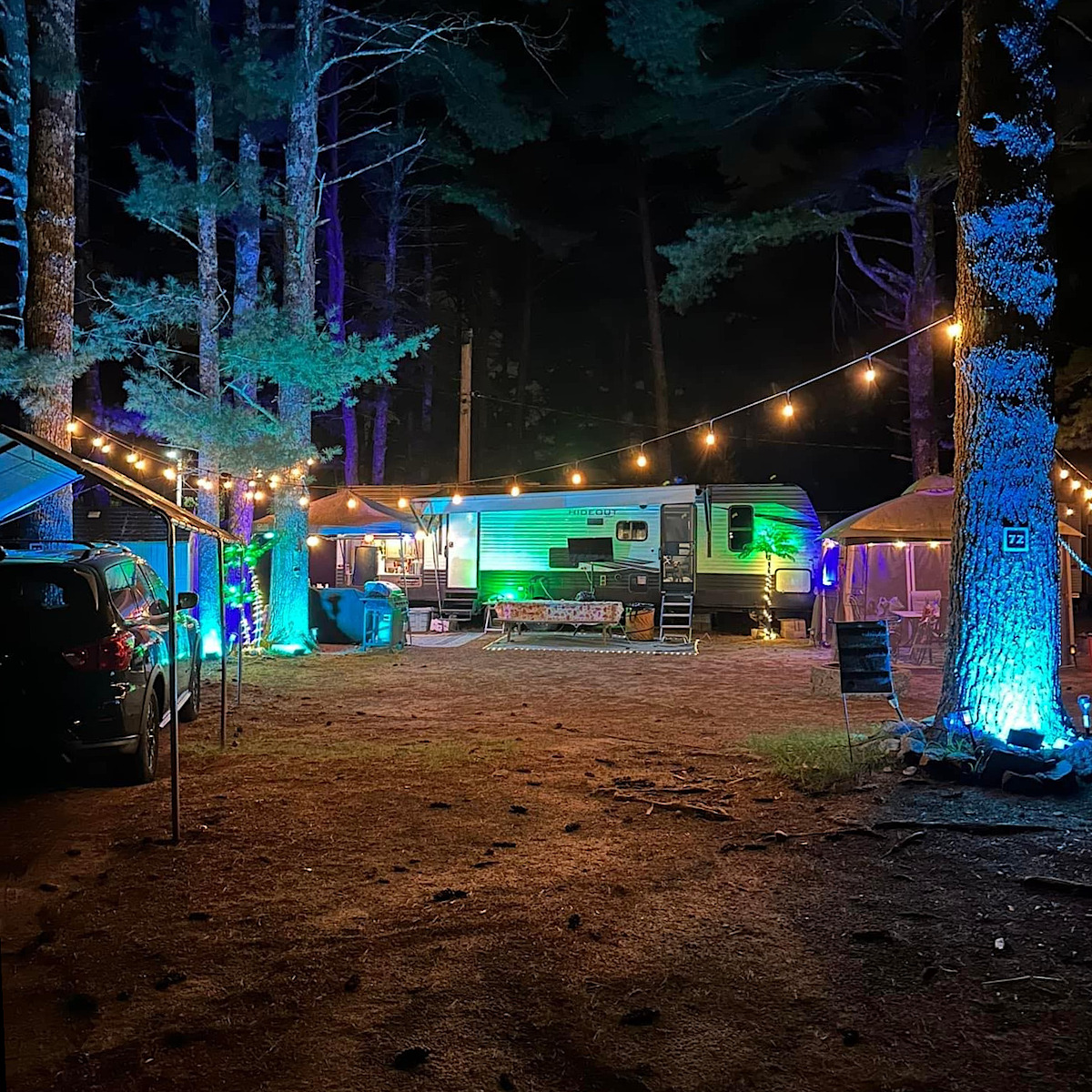 brightly lit campsite at night